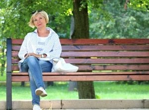 Woman in a park bench
